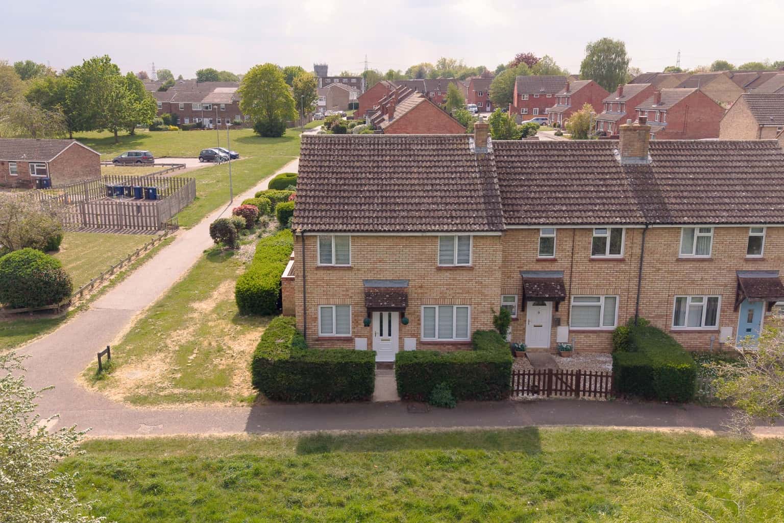 Beautifully extended four bedroom end of terrace property overlooking open green space to front Property image 1
