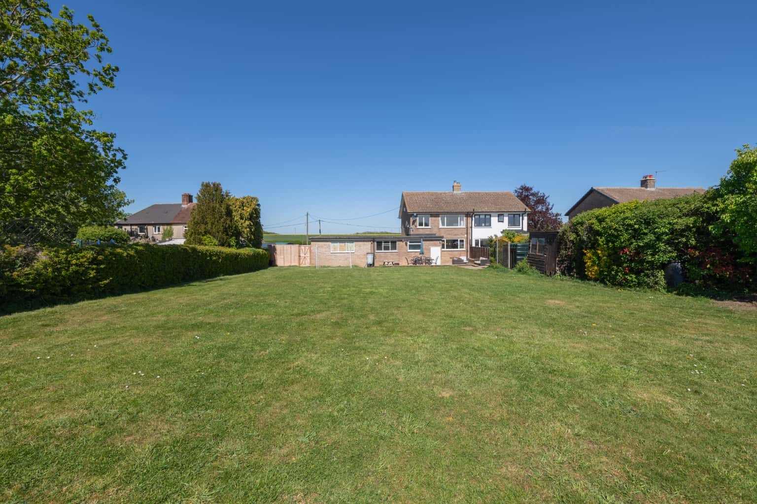 Three bedroom semi-detached home occupying a large plot with double garage. Property image 2